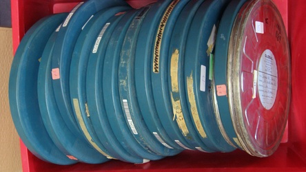 Pile of English 16mm positive film reels